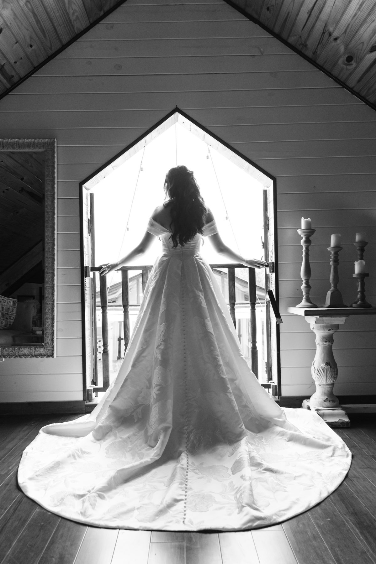 A bride looking through the open doorway of the estate's bridal suite