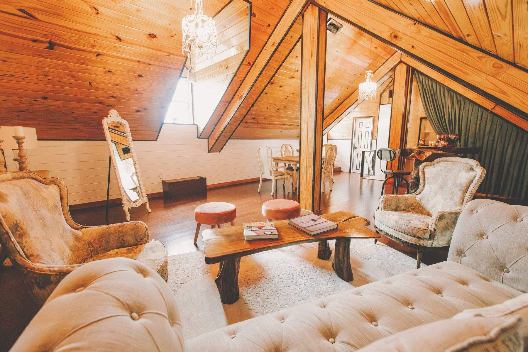 The warm wood-lined private suite with mirrors, lounge seating, and getting-ready space