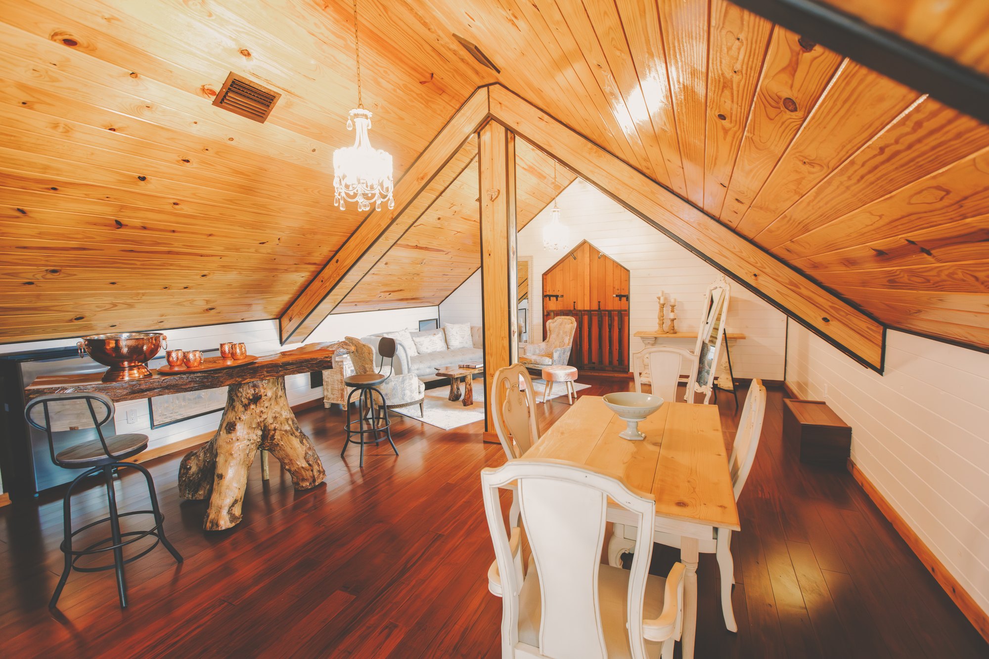 The warm wood-lined bridal suite with seating, mirrors, and preparation space
